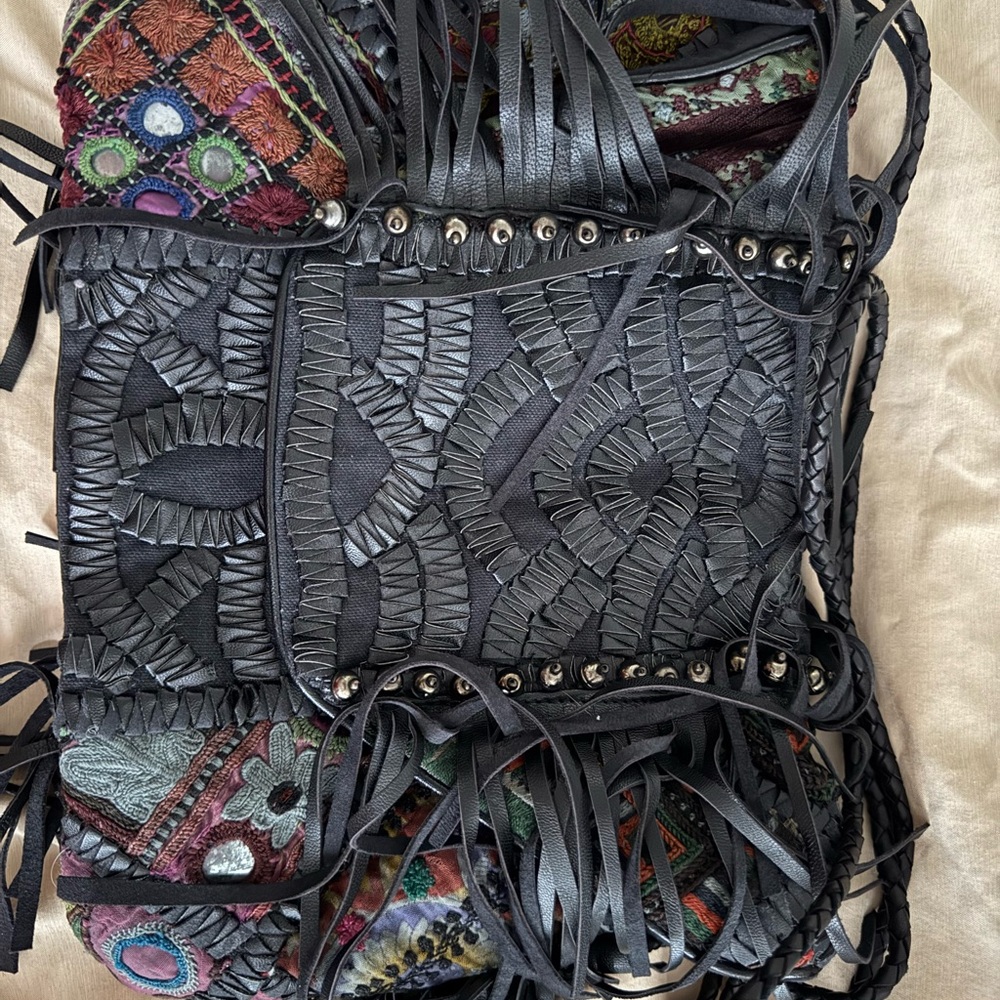 Black Crossbody Bag with Intricate Leather Detailing
